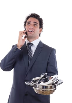 sad man with cooking pot seeking lunch on mobile phone