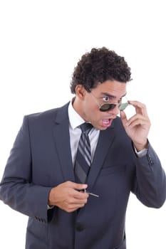 surprised and shocked young businessman with glasses holding keys