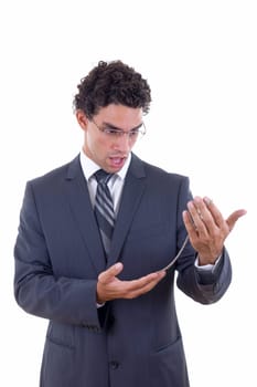 surprised jewelery buyer in business suit holding silver necklace