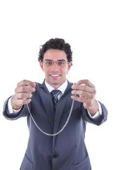 businessman in suit with glasess offers a silver necklace as a gift