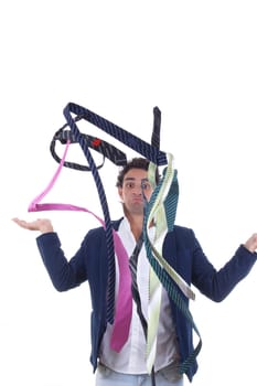undecided man in suit with lot of ties all around him