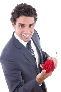 seducer in suit and sunglasess smiling with rose