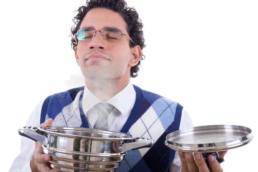 adult man with glasses smelling delicious lunch from pot with steam
