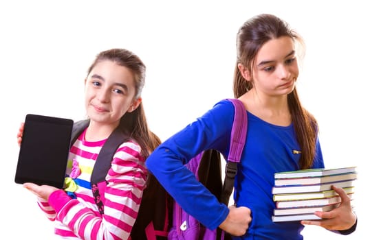 Teenage Girls Using Digital Tablet and books.
