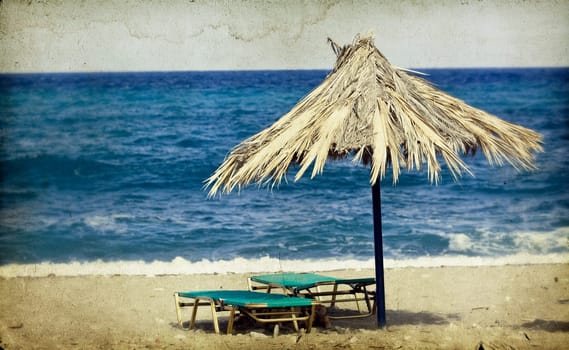 Vintage photo of chairs and umbrellas on the beach