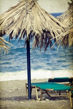 Vintage photo of chairs and umbrellas on the beach