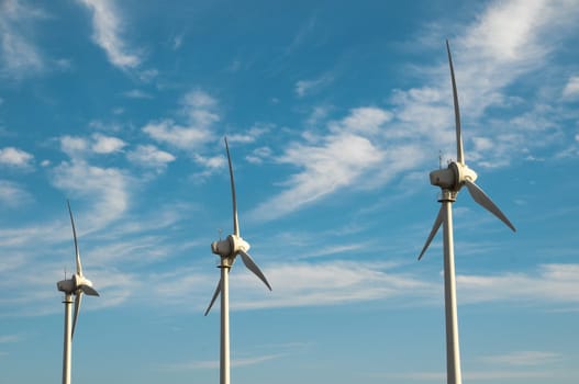 Eletric Power Generator Wind Turbine over a Cloudy Sky
