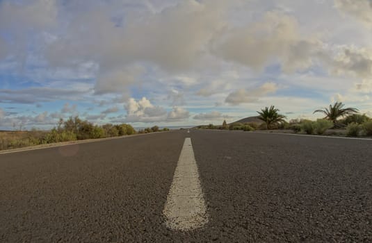 Long Empty Desert Road on a Cludy Day