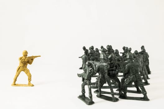 Plastic Lead Soldiers Representing War on a White Background