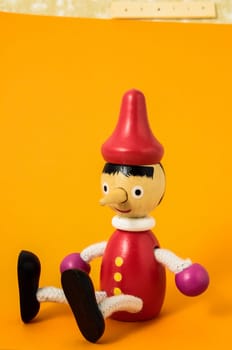 Pinocchio Toy Statue on a Colored Background