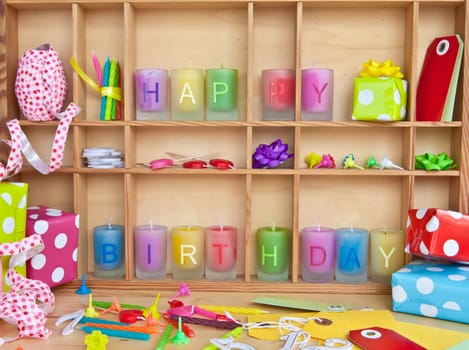 Happy Birthday written on colorful candles and gifts