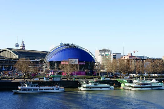Cologne,Germany – February 02,2014: The Cologne Opera at the Cathedral opposite a jetty with passenger ships on February 2,2014 in Cologne.