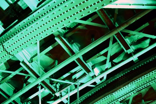 The photograph of a tunnel ceiling illuminated with green light.