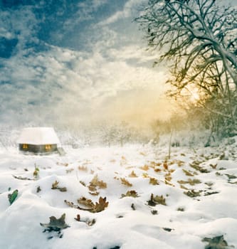 Idylic winter house at sunset. Texture added.