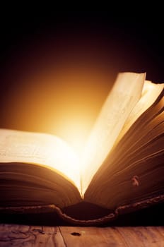 Open book with magic light