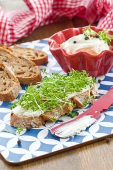 Fresh bread with fresh cheese and cress