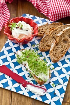 Fresh bread with fresh cheese and cress