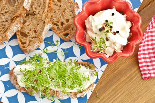 Fresh bread with fresh cheese and cress