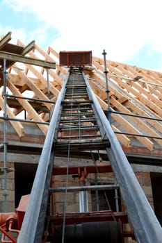 Roofing work with construction hoist