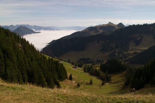 mountain view,valley,cloud,overcast,morning,meadow,green,spring,summer,haze,bell,alpine valley,foothills of the Alps,Bayrischzell,ski area,hiking