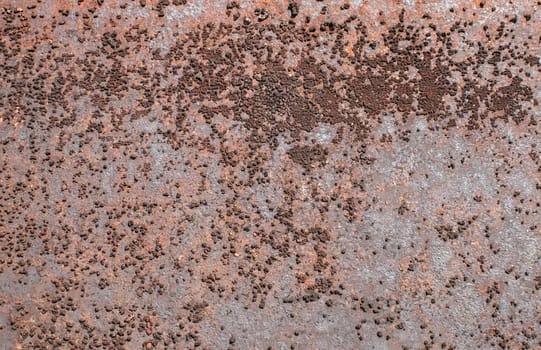 Weathered, rusted and corroded metal surface as background