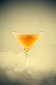 A classical drink  glass with fruit juice