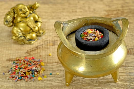 Incense bowl with smoked charcoal and fumigant