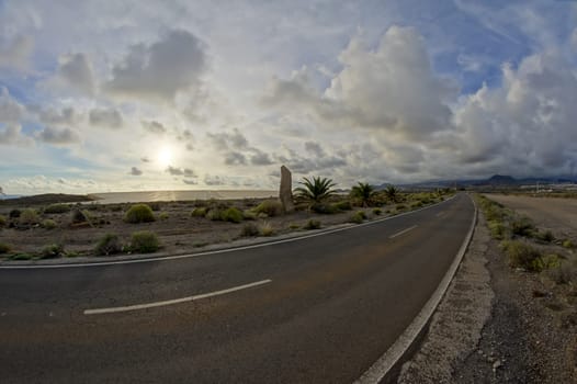Long Empty Desert Road on a Cludy Day