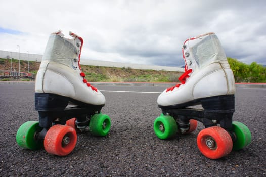 Old Vintage White Skate Boot on the Asphalt Sterret
