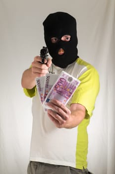 White Dressed Young Man Holding a Pistol Gun