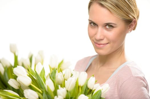 Romantic woman with bouquet of white tulip flowers