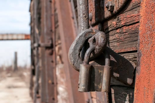 Old weathered latch and padlock on an vintage railway wagon