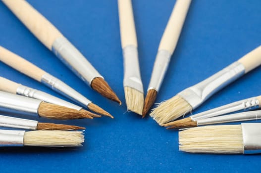 New Wooden Different Paintbrush Set Texture over a Colored Background