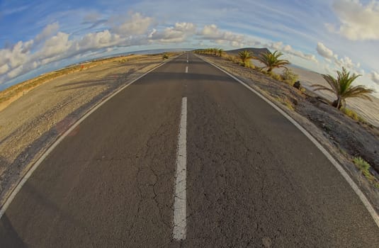 Long Empty Desert Road on a Cludy Day