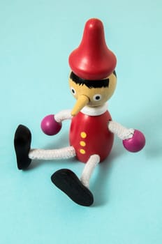 Pinocchio Toy Statue on a Colored Background