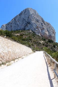 Natural Park of Penon de Ifach situated in Calp, Spain. A massive limestone outcrop emerging from the sea and linked to the shore by rock debris. Is home to numerous rare plants and over 300 species of animals, and nesting site for sea birds and other birds.