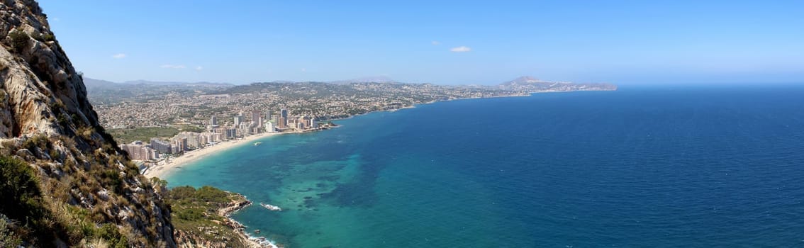 Panoramic view over Calp (Spain). Town bay beach