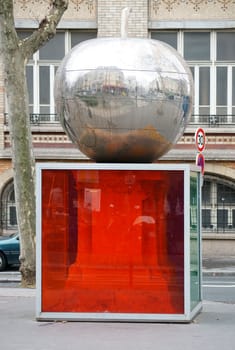 Paris,France – January 01,2014: The reflective apple sculpture with world map on Boulevard de Clichy-Trinity,Montmartre on January 1,2014 in Paris.