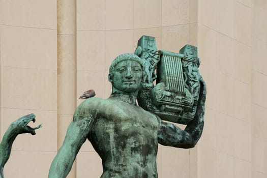 Paris,France – December 29,2013: The bronze sculpture Apollo by Bouchard in front of the "Musée des Monuments Français"" on the terrace of the Palais de Chaillot on December 29,2013 in Paris."