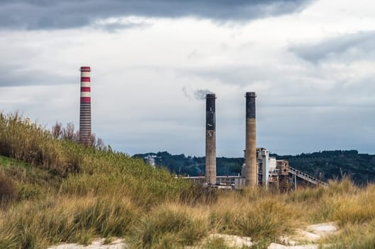 Smoking chimneys in a factory for bicarbonate production