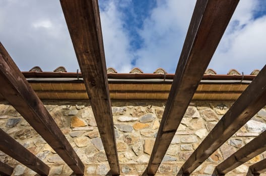 Wooden pergola bult in a rural farm in the tuscany countryside