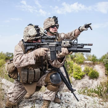 Two soldiers in the mountains during the military operation