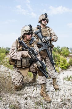 Two soldiers in the mountains during the military operation