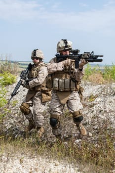 Two soldiers in the mountains during the military operation