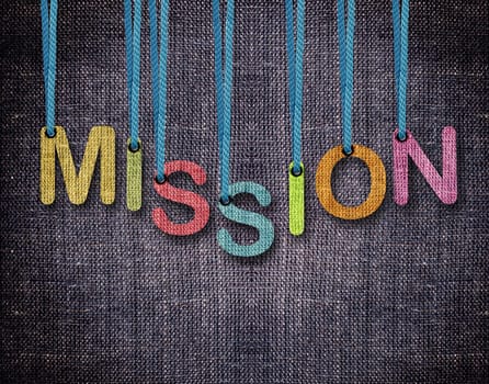 mission Letters hanging strings with blue sackcloth background.