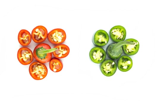 red and green hot chili pepper slices on a white background