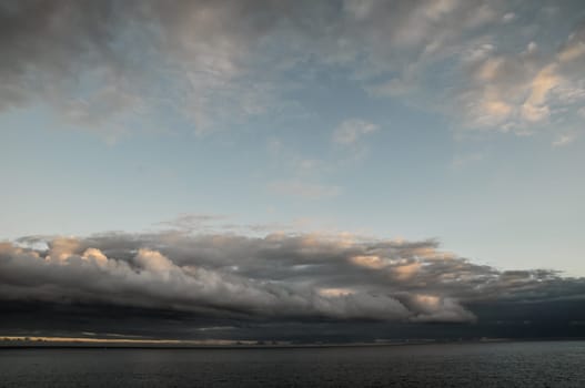 Cloudscape, Colored Clouds at Sunset near the Ocean