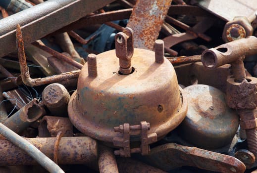 Rusty industrial details on metal collector of garbage