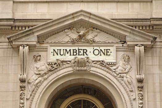 The facade of the building with the inscription NUMBER ONE above the entrance