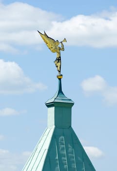 Angel statue blowing hornon a tower of wall of Optin Hermitage
